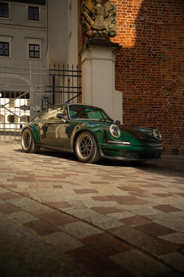 The deep shade of green engages in a subtle interplay with the shadows, revealing the artistry of the paint finish.