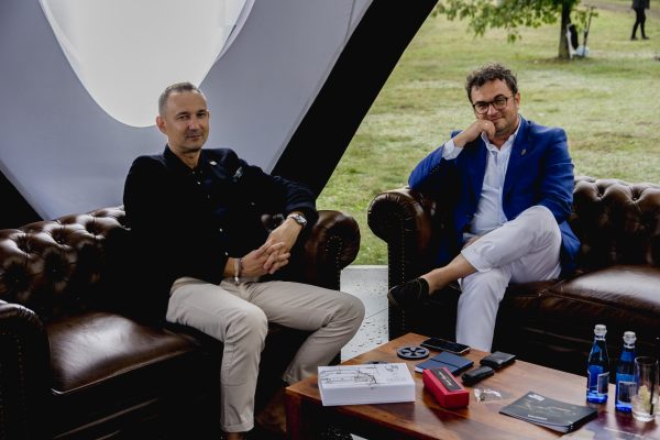 RCR leadership and marketing team seated in a lounge area during an outdoor lifestyle event.