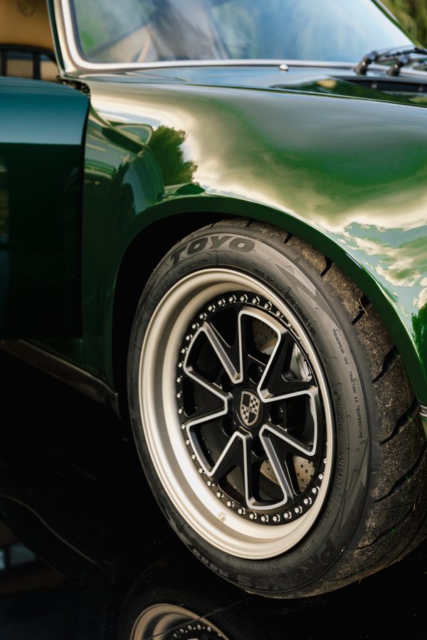 Custom RCR wheel inspired by classic Fuchs design, fitted with modern performance tire.