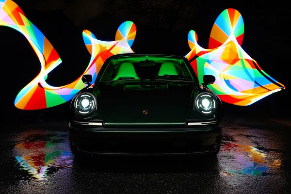 RCR Cars Porsche 911 restomod front view with LED headlights and light painting background