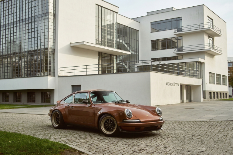 Porsche restomod by RCR parked in front of the Bauhaus Dessau building